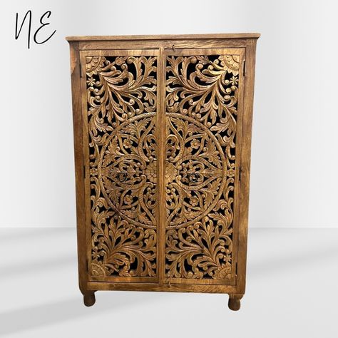 ✨ Introducing the Niktan BEAUTIFUL ORNATED CARVED ARMOIRE ✨ .................................................................................................. ............................. ..................... ............. ....... .... ... .. . Transform your home with this stunning wardrobe, a true masterpiece crafted with meticulous attention to detail. Hand-carved from sustainable mango wood and finished with a modern natural, this armoire features intricate floral carvings and a polishe... Carved Wardrobe, Carved Armoire, Carved Cabinet, Indian Room, Hallway Colours, Wood Armoire, Wardrobe Designs, Wooden Wardrobe, Carved Furniture