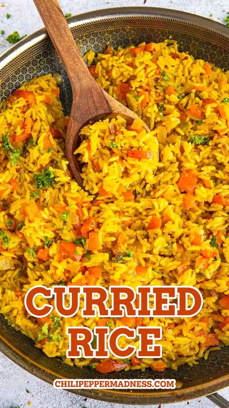 Curried Rice in a pan with a wooden spoon inside. Curry Rice Recipes, Curried Rice, Rice Dishes Recipes, Rice Side Dish Recipes, Spicy Rice, Rice Recipes For Dinner, Rice Side Dishes, Curry Recipes Indian, Easy Rice Recipes