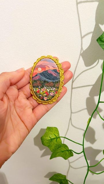 VINA adore life on Instagram: "Spilling the tea on how I make my signature Gold Frames!! 🫢🪞🖼️🌷✨ This is part 2 of this Sunset Mountain design! Watch part 1 to see the creation process happen! 🥰 Follow for more Clay Painting & updates on when these pieces are LIVE in the shop!! 😁🌷🧚🏽‍♀️✨ @vina.shop.uk - - - - - - - - - - - - - #polymerclaypainting #polymerclayjewelry #polymerclaycreations #polymerclayart #fairycore #cottagecore #mushroomcore #magicalartwork #fairyfashion #goldframes #artp Framed Polymer Clay Art, Polymer Clay Mountains, Painting With Polymer Clay, Air Dry Clay Photo Frame, Polymer Clay Frame, Mythical Accessories, Clay Landscape, Clay Painting, Polymer Clay Painting