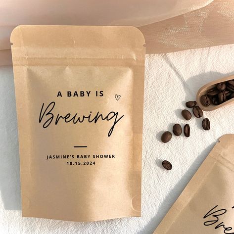 These personalized coffee pouches will make the perfect baby shower favors. Share your favorite coffee blend or tea blend with your guests in these personalized resealable favor bags. Customize your baby shower favors and make them uniquely yours! To order, simply include your name and date in the personalization box above.  ➜ Check out all the other goodies in our shop here: https://www.etsy.com/ca/shop/BlossomPaperieShop?ref=seller-platform-mcnav  WELCOME TO BLOSSOM PAPERIE SHOP   At Blossom P Coffee Party Favors, Something Sweet Is Brewing, Starbucks Baby Shower Ideas, Coffee Bar Baby Shower Ideas, Coffee Theme Gender Reveal, Coffee Shop Baby Shower Ideas, Party Favor, Coffee Baby Shower Cookies, Fall Baby Shower Favors