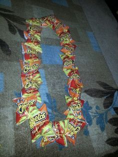 My hot cheetos lei for my nephews graduation. Hot Cheetos Lei For Graduation, Lolly Lei, Diy Lei, Graduations Ideas, Graduation Candy Lei, Grad Leis, Candy Leis, Money Lei Diy, Lei Ideas