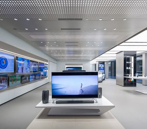 LeEco Experience Showroom using Formica® Laminate Electronics Store Design, Metal Panel Ceiling, Mall Ideas, Electronic Store, Grey Floor Tiles, Tv Shopping, Showroom Interior Design, Store Interiors, Electronic Shop