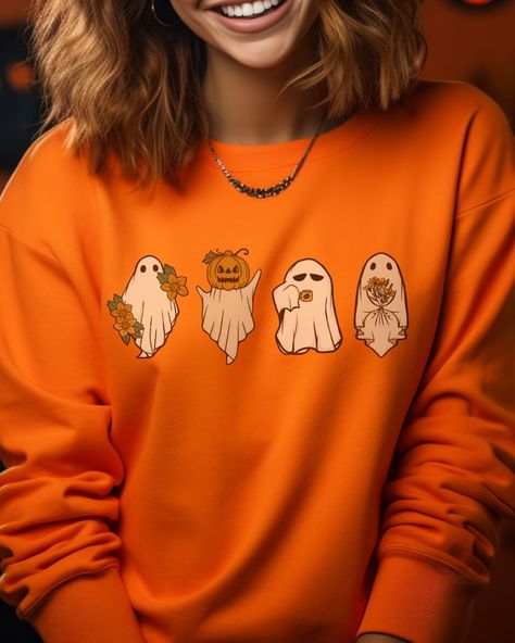 Halloween isn't complete without this retro pumpkin ghost sweatshirt! Get spooky and festive with this vintage-inspired style! 'Tis the season to get ghoulish and feel the chill in this comfy top. Spooky Season Clothes, Pumpkin Clothes, Retro Pumpkin, Season Aesthetic, Ghosts Halloween, Fun Office, Spooky Party, Autumn Sweater, Ghost Sweatshirt