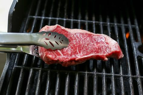 The New York strip, named as a nod to its popularity in that city's great steakhouses, is a sheer pleasure to grill. It rivals the rib eye with its marbling, tenderness and natural flavor (no marinades required!), but lacks the thick seams of fat that make rib steaks so prone to alarming flare-ups. Cut from the tender and flavorful loin muscle, the... Steak On Gas Grill, Ny Strip Steak Recipes, Sirloin Steak Recipes, New York Strip Steak, Strip Steak Recipe, Grilled Ribeye, Top Sirloin, Rib Steak, New York Strip