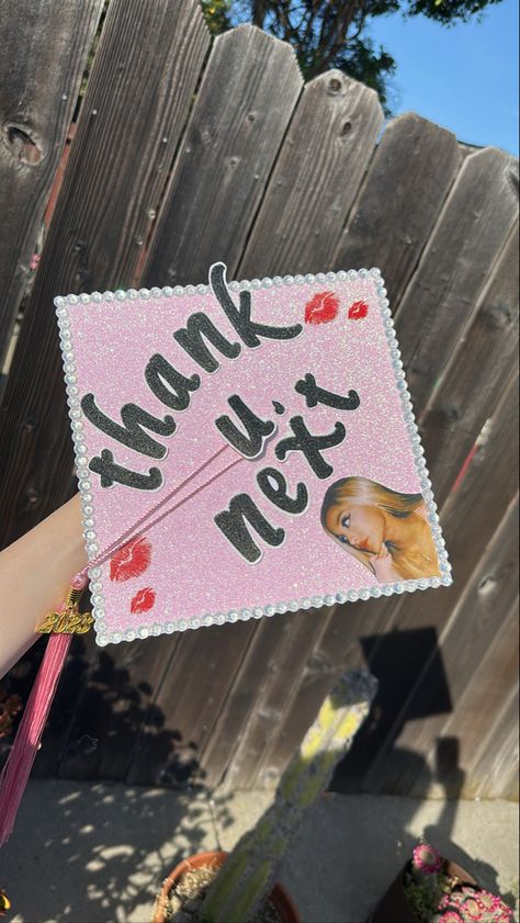 ariana grande graduation cap pink Grad Cap Lana Del Rey, Graduation Cap Designs Ariana Grande, Ariana Grande Graduation Cap, K-12 Graduation Cap, Graduation Cap Designs Nicki Minaj, Nicki Minaj Grad Caps, College Grad Cap Ideas, Grad Hat, High School Graduation Cap