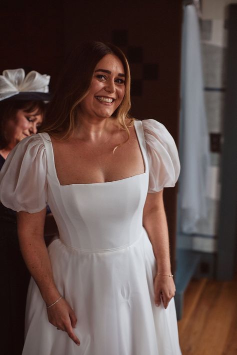 Smiling happy bride in a puff sleeve Suzanne Neville wedding dress. Bridgerton inspired bride. The Springles Photography. Morning Wedding Dress, Bridgerton Style Wedding, Cowley Manor, Suzanne Neville Wedding Dress, Suzanne Neville Wedding Dresses, Bell Sleeve Wedding Dress, Glamorous Curls, Tiered Wedding Dress, Colourful Bouquet