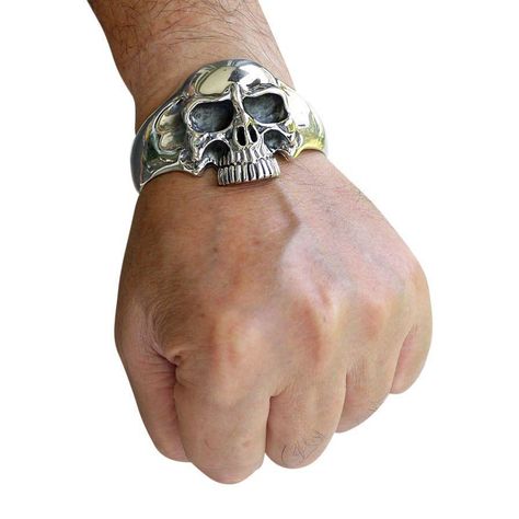 CLASSIC 925 STERLING SILVER CUFF BRACELET ~BRAND NEW This beautiful classic cuff bracelet made from sterling silver is very popular with our site visitors because it is so unique in many ways. Apart from the bulky design which appeals to many, you will surely notice the beautiful way the skull is made to stand out nice