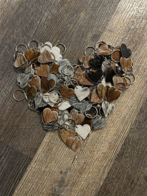 🌵Cowhide Heart Keychains. An adorable addition to your purse, luggage, keys, bookbag or ID Tag. The teens will love this one as a gift! 🌵 Cowhide will vary based on what I have in stock. Each pattern will be unique as these are made from real hair on hide cow hide. No pattern can be duplicated. Cowhide Crafts Diy Ideas, Western Diy Projects, Cow Hide Crafts, Cow Hide Projects, Cowhide Hair Jewelry, Cowhide Projects, Cowhide Crafts, Cowhide Accessories, Cowhide Jewelry Case