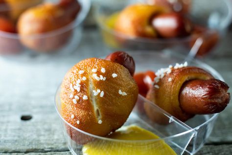 These Pigs in a Pretzel Blanket (pretzel wrapped little Smokies) are a fun and tasty snack or appetizer perfect for game day parties or whenever the mood strikes you. As you will find out below, these little bites of deliciousness are easy to make and versatile enough to be served at many different kinds of events. Pigs In Blanket, Wrapped Smokies, Little Smokies, Pretzel Bun, Pretzels Recipe, Pigs In A Blanket, Different Kinds, A Blanket, Dipping Sauce