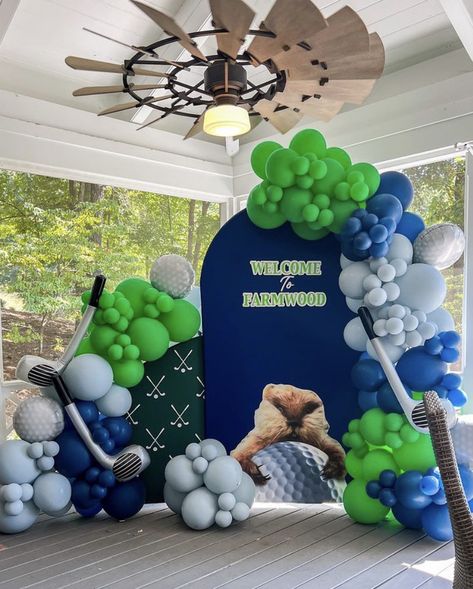 Two custom arch walls w/ balloon garlands around the arches in the colors spring green, sapphire blue & fog. Golf Party Balloon Garland, Birthday Decor Ideas For Men, Golf Balloon Garland, Birthday Decor Ideas, Golf Birthday Party, Bounce House Rentals, Golf Party, Golf Birthday, Balloon Arrangements