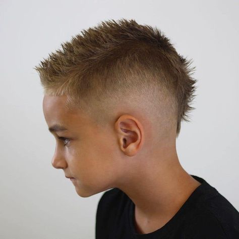 Kids Mohawk Haircuts: For Boys + Girls Kids Mohawk Haircut Short, Faded Mohawk Boys Haircut Short, Fade Mohawk Kids, Patrick Mahomes Haircut For Boys, Boys Mullet Haircut Kids Straight Hair, Fohawk Haircut Fade Kids, Little Boys Mohawk Haircut, Eurohawk Boys Haircut, Boy Mohawk Haircut Kids