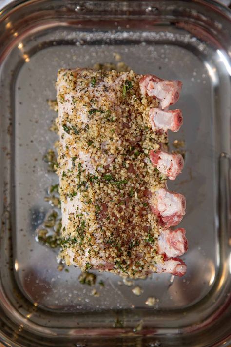 Roasted Rack of Pork is a show-stopping, holiday main dish crusted with garlic, fresh thyme and rosemary or use boneless pork loin for easy weeknight meals. #dinner #pork #porkribs #roastedgarlic #garlic #dinnerthendessert Bone In Pork Loin, Pork Rib Roast, Brown Sugar Pork Chops, Rack Of Pork, Herb Rack, Pork Loin Roast Recipes, Rib Roast Recipe, Pork Chop Recipes Baked, Boneless Pork Loin