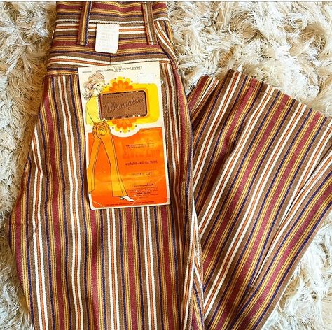 The dreamiest bell bottoms we ever did see!! Authentic vintage, 1970's, Wrangler brand Gorgeous orange, brown, and gold stripe tones Flared leg With groovy original page from the 70's Super RARE and rad vintage find! Good pre-loved vintage condition 100 % cotton Original Tag reads: Authentic 70s Outfits, Hippie Outfits 70s Bell Bottoms, Authentic 70s Fashion, Striped Bell Bottoms, 1970s Glam, 70’s Aesthetic, 70s Inspired Fashion, 70s Outfits, 70’s Fashion