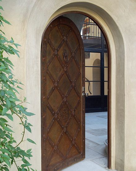 #Tuscan Style door in archway.  #Mediterranean rustic style door. #Spanish Colonial Style Entry Front Door Mediterranean Entryway, Mediterranean Doors Front Entry, Mediterranean Front Door, Mediterranean Entryway, House Fixtures, Mediterranean Doors, Arched Interior Doors, Small Home Remodeling, New Front Door