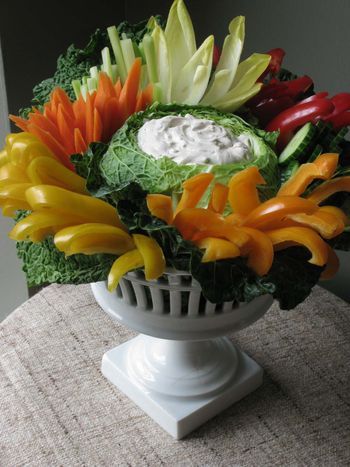 Wow! A stunning presentation of crudites AND a centerpiece (at least while it lasts) AND a great conversation piece. There's a tutorial for hollowing out the cabbage on the site. Vegetable Trays, Veggie Display, Vegetable Tray, Decorações Com Comidas, Fruit Displays, Party Trays, Charcuterie Recipes, Veggie Tray, Food Displays