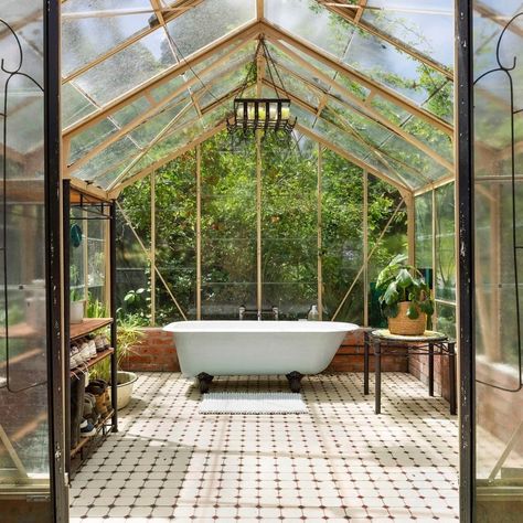 Domain on Instagram: “Pulled from the pages of a fairytale, this bathtub setup is for those who love the outdoors 🌿🛁 Drenched in sunlight, the greenhouse takes…” Outside Bathhouse, Greenhouse With Bathtub, Outdoor Greenhouse Bathroom, Bathtub Greenhouse, Green House Bathroom, Forest Bathrooms, Greenhouse Bathtub, Greenhouse Sauna, Hot Tub Greenhouse