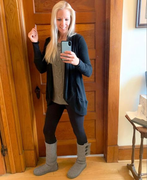 Blonde woman wearing tall gray Ugg boots with black leggings. She also has on a gray cable knit sweater and a black cardigan. Ugg Classic Cardy Boot Outfit, Ugg Knit Boots Outfits, Ugg Cardy Boots Outfit, Gray Boots Outfit, Gray Uggs Outfit, Ugg Fits, Uggs Outfit Winter, Bear Paw Boots, Ugg Cardy Boots