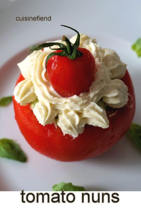 Tomato nun, la religieuse de tomate, is an exquisite appetiser of cold, uncooked tomato stuffed with pesto-flavoured burrata cheese. Tomato Stuffed, Classic Appetizers, Burrata Cheese, Buffalo Mozzarella, Whipped Feta, Salmon Dishes, Tomato And Cheese, Food Heaven, Ripe Tomatoes