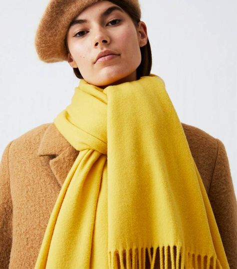 How to Wear a Scarf in 2019 | Who What Wear UK Wear A Scarf, Winter Scarves, How To Wear A Scarf, Yellow Scarf, Oversized Scarf, How To Wear Scarves, Wool Scarf, Pale Yellow, Knit Scarf