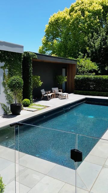 Lee Gray Landscape Design on Instagram: "Landscape Design: Poolside . Design: @leegray_landscapedesign Landscaper: @outscape_constructions Pool: @elitepoolsandlandscapes Maintenance: @ahs_pty_ltd . Pool Fence: @allfence_adelaide Photography: @dronebymg Bluestone: @ecooutdoor Furniture: @ecooutdoor Plants: @sa.grown Irrigation: @waterproau Soils: @jeffries_group Industry Support: @masterlandscaperssa, @masterbuilders_sa, @spasaaustralia Dark Grey Pool Tiles: @thepooltilecompany . #lan Grey Swimming Pool, Grey Pool Tile, Dark Pool Tile, Dark Green Pool Tiles, Cheap Pool Ideas Budget, Poolside Design, Dark Blue Pool, Leisure Pools Graphite Grey, Grey Pool