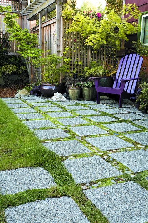 The water-permeable patio of Seattle resident Jennifer Carlson, created with 12" of crushed rock, covered by landscape fabric, covered by 1" of sand, covered by pavers. "Ribbons of stones" and moss betwixt the paver channels. Would be perfect under a pergola, no? Permeable Patio, Paver Ideas, Building A Patio, Permeable Pavers, Patio Pavers Design, Painted Patio, Deck Designs, Most Beautiful Gardens, Rain Garden