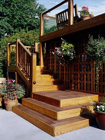 Decorative lattice to hide under the deck along with hanging plants Raised Ranch Deck Ideas, Lattice Alternative, Platform Steps, Patios And Decks, Deck Skirting, Ideas For Garden, Deck Steps, Deck Stairs, Garden Steps