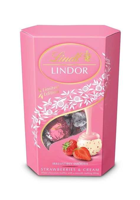 The packaging of Lindt truffles is a combination of unusual shape and color. The box is decorated with a pattern, which has no informative role, but gives a package more festive look. So a consumer can easily use this product as a nice present and does not have to wrap it into casing-paper, because it has already been packed nicely. We see the picture of fresh raspberry, so the producer is playing with our gustatory sense. Lindt Chocolate Truffles, Lindt Truffles, White Chocolate Truffles, Strawberry Powder, Lindt Lindor, Lindt Chocolate, Grocery Foods, Valentine Chocolate, Chocolate Packaging