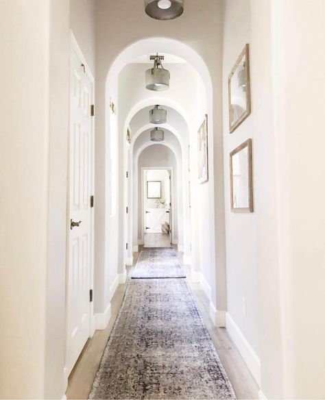 Every long hallway needs a runner or two. A subtle introduction like this one works well in a narrow space, not allowing it to become the… Hallway Runners Ideas, Decorating A Narrow Hallway, Jaci Daily, Foyer With Stairs, Long Hallway Runner, Mansion Bedroom, Hallway Light, Hallway Light Fixtures, Mansion Floor Plan