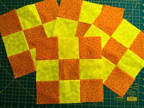 Four orange and yellow nine-patch blocks for this week’s quilt. Orange Quilts, Orange Quilt, Basic Quilt, Orange Square, Quilting Tools, Nine Patch, Quilting Rulers, Crib Quilt, Patchwork Patterns