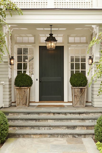 This is pretty much perfection in my book - oversized lantern, boxwood topiaries in weathered planters, transoms, natural stone incorporated in steps, black door, beautiful millwork & trim, Best Front Doors, Farmhouse Front Door, Porch Planters, Entry Lighting, Small Bedrooms, Casa Country, Farmhouse Front Porches, Front Door Entrance, Front Steps