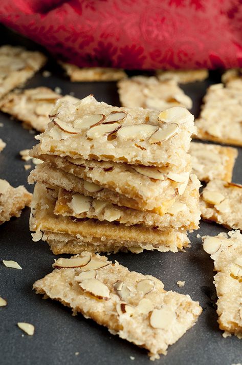 Almond Club Cracker Toffee   Prep time 10 mins Cook time 7 mins Total time 17 mins   Almond Club Cracker Toffee recipe is salty crackers coated in sweet toffee sauce & slathered with almonds. This will be your new favorite easy holiday treat! Author: Ashley Recipe type: Dessert Cuisine: American Serves: 30 crackers Ingredients 1 stick butter (1/2 cup) ½ cup sugar 1 tsp vanilla 1 sleeve Club crackers 1 cup slivered or sliced almonds Instructions Arrange crackers holes side up on cookie sheet wit Sweet Almond Crackers, Snacks With Club Crackers, Christmas Cracker Toffee With Club Crackers, Recipes With Club Crackers, Toffee Crackers Club, Club Cracker Cookies, Club Cracker Dessert, Club Cracker Bars, Saltiness Cracker Toffee