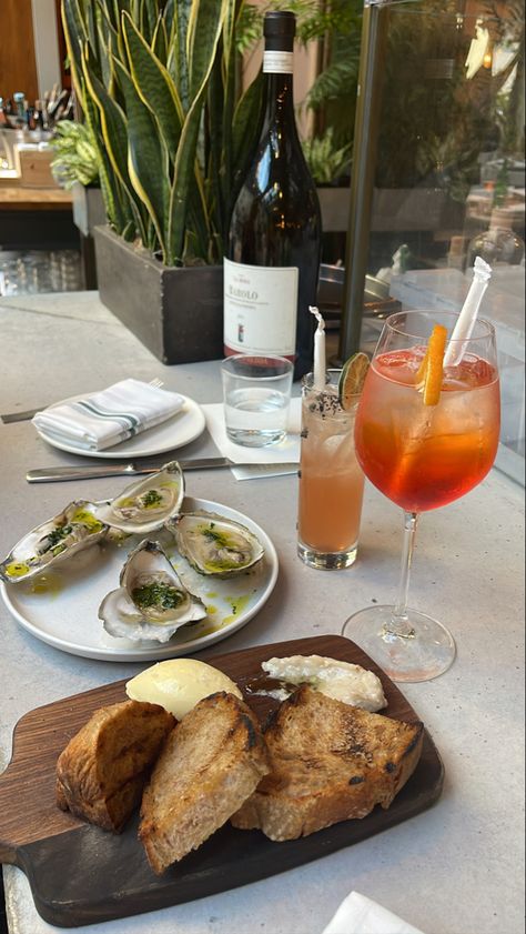 Bread and butter up front, wood fired oysters, tequila cocktail and an aperol spritz in a garden themed roottiop restaurant Boston Lifestyle, Italian Brunch, Boston Back Bay, Cocktail Aesthetic, Boston Aesthetic, Brunch Restaurant, Girls Dinner, City Pics, Boston Food