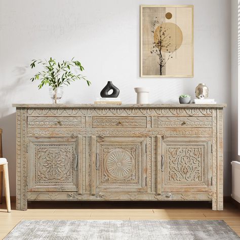 In the fusion of natural wood grains, distressed finish, hand carving details, and meticulously chosen other hues, Our Mendocino Distressed Hand Carved Mid Century Sideboard with 3 Drawers has a captivating and distinct aesthetic emerges. That is the magic of this mid-century sideboard – a showstopper that effortlessly combines nature’s allure with a touch of artistry, making it a true standout in any space. This multifunctional intricated hand-carved sideboard is a storage powerhouse with a sleek generous countertop surface, three cleverly dual-tiered cabinets, and three inline petite drawers. It is like a secret agent for your dishes and linens, complete with sturdy intricately hand-carved doors sporting sleek metal hardware equipped with wooden latches and drawers donning iron knobs for Carved Sideboard, Painted Sideboard, Buffets & Sideboards, Countertop Surfaces, Mid Century Sideboard, Antique Sideboard, Solid Wood Sideboard, Cabinet Style, Carved Doors