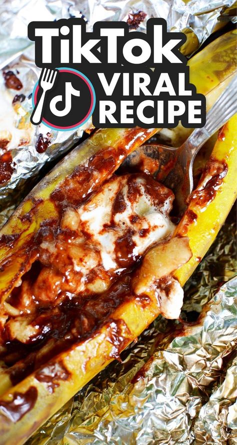 Campfire Banana Boats – a new campfire tradition that your entire family will enjoy! The bananas are split with marshmallows and chocolate and then warmed up over a fire for a creamy, delicious bite ripe for digging into. TikTok Viral Recipe - Campfire Banana Boats are split open bananas with mini marshmallows and chocolate and then roasted over an open fire. A delicious and easy campfire treat the whole family will love! Banana Campfire Dessert, Campfire Desserts Easy, Campfire Banana Boats, Banana Boat Recipe, Campfire Dessert, Campfire Bananas, Nutella Dessert Recipes, Coke Recipes, Banana Boats