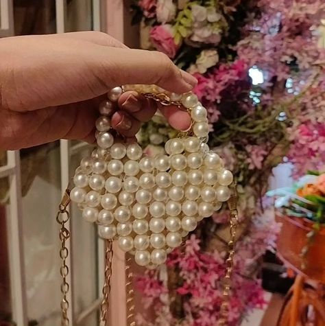 Took My Heart Mini Sling Bag 🤍 The Pearl Mini Heart Bag is a charming accessory featuring a heart-shaped design, typically crafted from high-quality materials. It's adorned with pearl embellishments, adding a touch of elegance. This compact bag usually comes with a detachable chain or strap for versatile carrying options and is perfect for adding a whimsical flair to any outfit. #pearlbag #heartshapebag #heartbag Mini Sling Bag, Heart Shaped Bag, Compact Bag, Pearl Bag, Heart Bag, Mini Heart, The Pearl, Sling Bag, My Heart