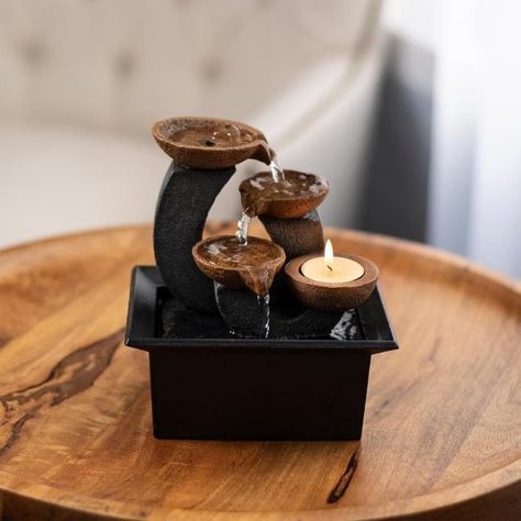 CALMING ATMOSPHERE - The fountain cascades water over 3 tiers of shallow bowls to create a calming, Zen-like atmosphere in your home, The built-in tea light candle holder can provide peaceful and intimate lighting for any room in your home. LOW MAINTENANCE-This fountain is self-contained, meaning it requires no additional hardware or plumbing to use, Just lift the top off the base, fill it with distilled water and plug it into a standard electric outlet to enjoy your water feature. DURABLE MATER Intimate Lighting, Tabletop Water Fountain, Indoor Water Fountains, Indoor Waterfall, Pond Fountains, Tabletop Fountain, Fountain Feature, Indoor Fountain, Tea Light Candle Holder