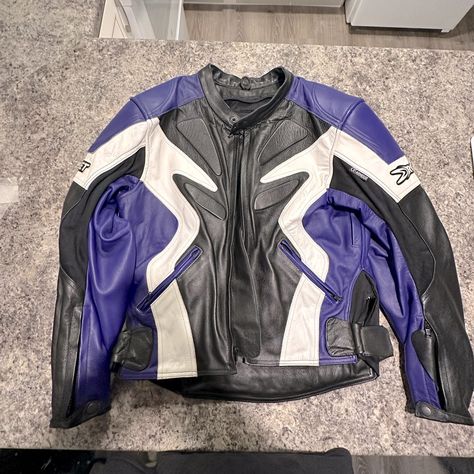 Leather Jacket In Brand New Condition. Rich Purple, Deep Black And A Touch Of Metallic Silver On The Back. All Zippers Are Rugged And In Perfect Condition. All Snaps, Buckles, Velcro And Compartments Are In Exceptional Condition. Jacket Could Not Have Been Worn More Than A Handful Of Times. Size Small. Hefty Pads On The Arms, And High Shoulders Keep You Protected In The Case Of An Accident. Very Sturdy Leather But Its Flexible And Supple For Comfort Purple Racer Jacket, Motor Jacket, Space Jacket, Motorcycle Fashion, Race Car Jacket, Designer Winter Jackets, Purple Leather Jacket, Bike Jacket, Black Leather Motorcycle Jacket