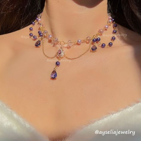 Fanciful Fairycore Jewelry 🧚 on Instagram: "Jennette Necklace 💜✨👑

A magical blend of royal purples and lavenders. Big thanks to @rana_simp4kaeya for the name idea (I know you love purple!) and a magical shoutout to @dressinguprocks for helping create this beauty! 💜

.
.
.
.
#fairycoreaesthetic #fairycorefashion #fairycorejewelry #fairyaesthetic #fairymagic #fairyvibes #dreamyvibes #fairyforest #fairycosplay #fairytalefashion #cottagecoreaesthetics #cottagecorejewelry #beadedjewelry #cottagecorefashion #oldmoney #bridgerton #bridgertonvibe #bridgertonjewelry #gemstonenecklaces #magicjewelry #sparklejewelry #magicaljewelry #crystalnecklace #aestheticlover #fairycorenecklace #beadednecklaces #angelcoreaesthetic #princessvibes #necklaceaddict #fairystyle" Bridgerton Jewelry, Coquette Necklace, Fairycore Princess, Jewelry Coquette, Jewelry Bride, Fairy Jewelry, Bride Jewelry, Jewelry Elegant, Magical Jewelry