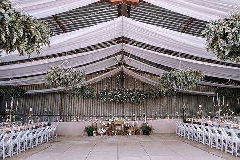 Hangar Wedding Decor, Metal Shop Wedding Reception, Boho Wedding Ceiling Decor, Machine Shed Wedding Reception, Machine Shed Wedding, Pole Barn Wedding, Wedding Plants Decor, Influencer Dinner, Garage Wedding