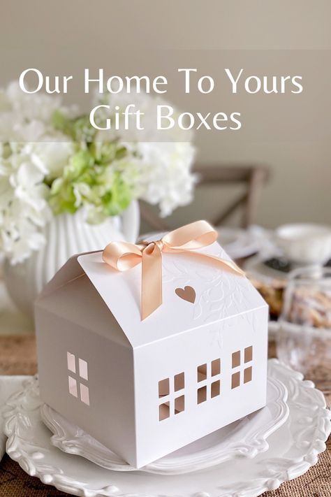 A pretty house shape box with cut outs for windows and hearts and tied with a satin ribbon on the roof sits atop a small stack of white plates. Dessert Fancy, Small Cake Boxes, Christmas Cookies Packaging, Gift Box Cakes, Dessert Box, Cookie Gift Box, Tooth Fairy Box, Cookie Boxes, Bakery Boxes