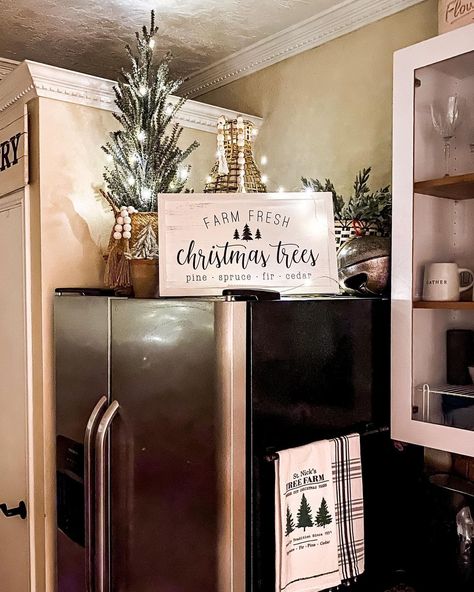 Amber Vestal on Instagram: “I love decorating above our fridge! 🎄✨ it adds such a festive glow at night. Those a $16 Walmart tree and some twinkle lights up there and…” Top Refrigerator Decor Ideas, Above Fridge Decor, Top Of Refrigerator Decor Ideas, Top Of Fridge Decor Ideas, Top Of Fridge Decor, Top Of Refrigerator Decor, Farm Christmas Decorations, Fridge Top Decor Ideas, Fridge Top Decor