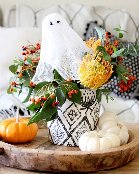 Cheesecloth Ghost in Fall Floral Arrangement Ghost Floral Arrangement, Halloween Reception, Halloween Centerpieces, Cheesecloth Ghost, Fall Floral Arrangement, Crunchy Leaves, Halloween Centerpiece, Fall Floral Arrangements, Fall Halloween Decor