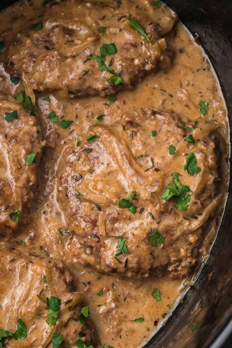 This Slow Cooker Cube Steak is the ultimate weekday comfort meal! The cube steak is seared and then slow-cooked with onions and garlic, creating a rich, creamy, and flavorful savory gravy with perfectly tender meat. Serve these smothered steaks with mashed potatoes and green beans for a balanced meal that will not leave you hungry! Crockpot Cubed Steak, Tender Cube Steak, Slow Cooker Cube Steak, Cube Steak Crock Pot Recipes, Marinated Steak Kabobs, Mashed Potatoes And Green Beans, Pot Roast Sandwiches, Smothered Steak, Beef Cubed Steak