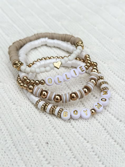 Complete your look with this trendy, neutral set of personalized stacking bracelets.  This is the perfect set to dress up your outfit with your loved ones names or meaningful words.  Choose how many name/word bracelets you would like in your set & please list the names/words you would like on the bracelet in the personalization section. I will message for any further questions!  *All bracelets come on a standard 7 inch, adult bracelet on high quality, stretchy elastic cord. If you need a different size, please specify in the personalization section.  *Over stretching and rough handling can cause bracelets to break.  Handle bracelets with care. Keep away from water, lotions and sprays. **Exchanges not offered on custom bracelets. *Buyer assumes ALL liability. Most Popular Beaded Bracelets, Diy Stackable Bracelets, Stacked Bracelet Ideas, Clay Bracelet Stack, Neutral Bracelet Stacks, Diy Clay Bead Bracelet Ideas, Trending Bracelets 2024, Neutral Clay Bead Bracelets, Stackable Bracelets Diy