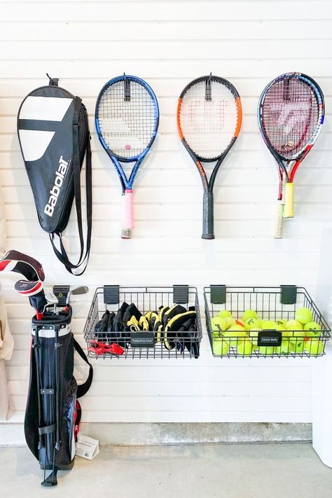 How To Store Balls In Garage, How To Organize Sports Equipment, Garage Organization Sports Equipment, Tennis Racket Storage Ideas, Tennis Racket Storage, Organizing Ideas Garage, Sport Equipment Storage Ideas, Garage Tool Organization Ideas, Garage Storage Ideas Organizing