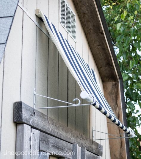 do it yourself fabric awning!  how cute and easy! must buy something that repels water for the patio slider! Shed Awning Ideas, Diy Awning, House Awnings, Fabric Awning, Outdoor Awnings, Door Awnings, Outdoor Sheds, Window Awnings, Diy Shed