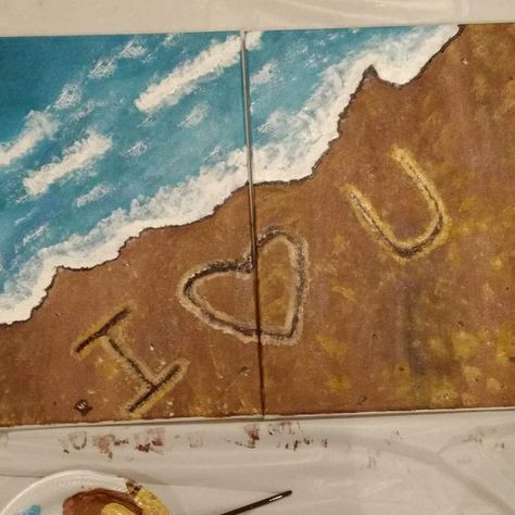 This is a split canvas painting. The whole painting is turquoise blue waves crashing into a sandy beige shore. A message is written in the sand with light tan. The message spells out I - heart in the middle and the letter U. Painting For Two People, Writing In The Sand Painting, Matching Couple Painting Ideas, Couples Easy Painting Ideas On Canvas, Mini Canvas Art Matching, Connecting Canvas Painting Ideas, Couple Painting Ideas To Do Together, His And Her Painting Ideas, Painting Ideas On Canvas Couples Love