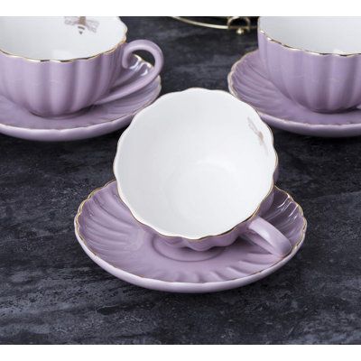 Cup 8 ounces, teapot 28 ounces. What's included: 4 teacups, 4 saucers, 4 teaspoons, a tea kettle, a sugar bowl, and a cream can (including display rack) IMPIAR | IMPIAR 8 OZ Coffee Cup / Teacup Saucer Spoons Teapot & Creamer Set 17-Pieces in Purple | 28oz | Wayfair