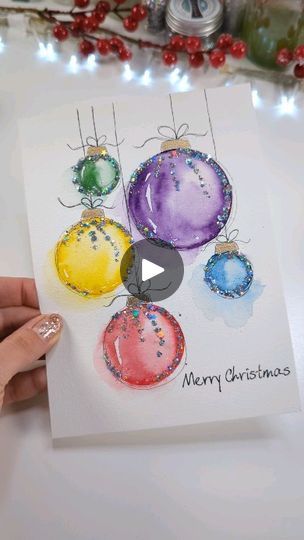 2.2M views · 34K reactions | How to Paint a Christmas Greeting Card with Colourful Baubles ⭐✨🪩❤️🩵💚💛🩷🧡💜 Use Stamping Painting Trick to create your Ornaments🎄 Learn how to paint EASY watercolor Baubles! Perfect painting idea for beginners, kids - no experience needed! ------ 🔗 links 🔗 to all products used in the video find in my Instagram profile click 'tap bio' link 🔗 ------- 🔹--- Stamp small circles ⭕ then paint it inside with watercolor paint 🎨 🔹--- In addition add some Glitter 🪩 ✨🔹 No matter how wobbly your design is, how uneven everything looks during the painting process, wait till you finish! 🔹--- Adding your finishing touches of doodles ✍️🖊️ and bling bring the whole design to live! 🔸 If you are a beginner in watercolors and are not sure how to start... Then just s Painting Christmas Balls, Painting Idea For Beginners, Watercolor Christmas Cards Diy, Christmas Cards Diy, Painted Christmas Cards, Paint Easy, Christmas Card Art, 카드 디자인, Homemade Christmas Cards