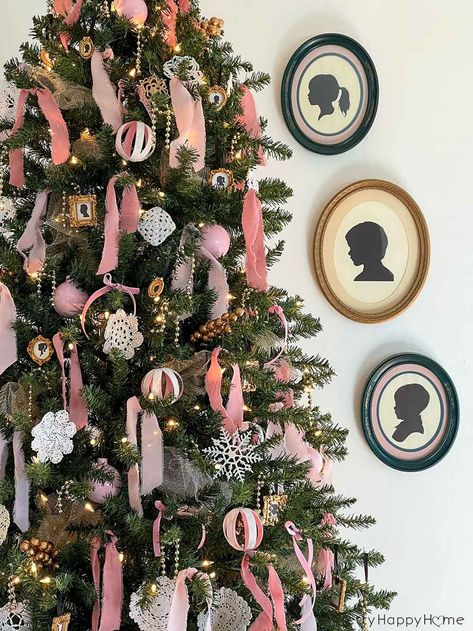 Use framed silhouettes on and around a Christmas tree for a nostalgic take on Christmas. Pink Christmas Tree Decorations, Pastel Christmas Decor, A Pink Christmas, Silhouette Ornaments, Christmas Tree Decorated, Crocheted Doilies, Bauble Ornaments, Pink Christmas Tree, Pink Christmas